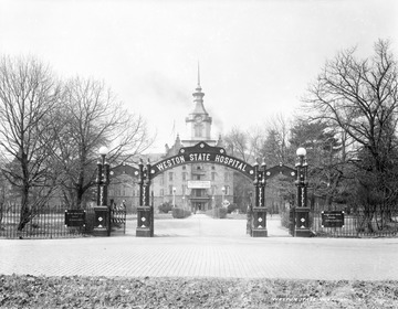 "The Weston State Hospital, also known as the Trans-Allegheny Lunatic Asylum, was constructed in the late 1800s and designated a National Historic Landmark in 1990. It is the largest hand-cut stone masonry building in North America, and is purportedly the second largest in the world, next to the Kremlin. The original hospital, designed to house 250 souls, was open to patients in 1864 and reached its peak in the 1950s with 2,400 patients in overcrowded and generally poor conditions. Changes in the treatment of mental illness and the physical deterioration of the facility forced its closure in 1994 inflicting a devastating effect on the local economy, from which it has yet to recover. Today, the hospital is open to historical tours and ghost tours."