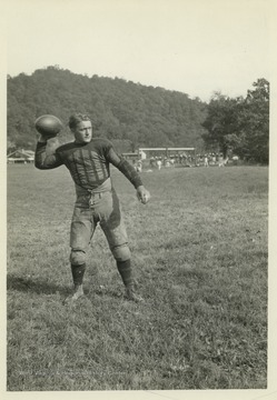 Varney reaches back as he prepare to throw the ball. 