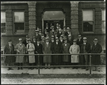 R. P. Davis's engineering class poses outside of the university building. 