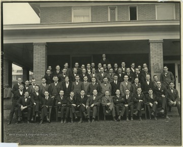 Members of the Kappa Sigma Fraternity WVU Chapter take a group photo outside of the fraternity house. 