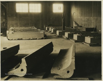 Molded cement structures fill a warehouse.