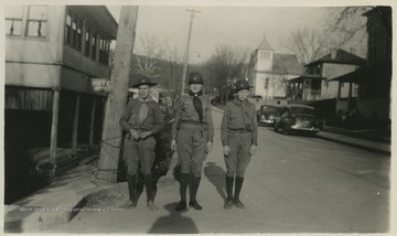 David B. Hathaway, center, poses with fellow Boy Scouts. On the left is the Jeffrey Hotel. 