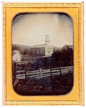 The steeple on the Buffalo Presbyterian Church is surrounded by scaffolding.