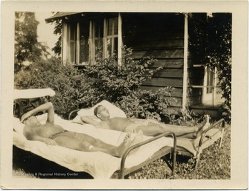 Two members of the Courtney family sunbathing.  The Courtney family is distantly related to West Virginia artist Blanche Lazzell.