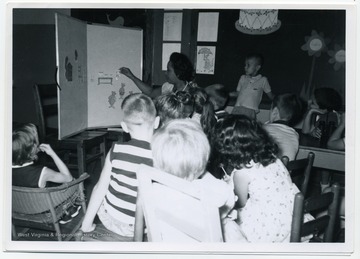 Victorine Louistall teaching a young group of students the story of Goldilocks and the Three Bears.