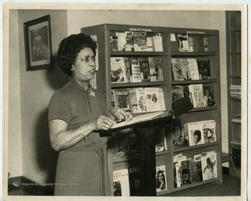 Victorine Louistall giving a presentation in what is likely the Clarksburg, W. Va. library.