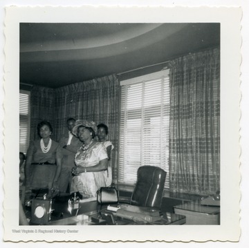 Mrs. Johnson greets guests as they tour Johnson's Publishing Co. in Chicago, Illinois.  The tour was part of Alpha Kappa Alpha's 39th Boulé conference.