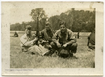 Melvin H. Kimble and unidentified friends getting ready for the Battle of the Bulge.