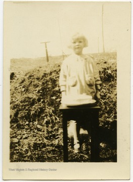 Beryl Nuzum with her birthday cake.  The Nuzum family lived in Fairmont, W. Va. at the time.