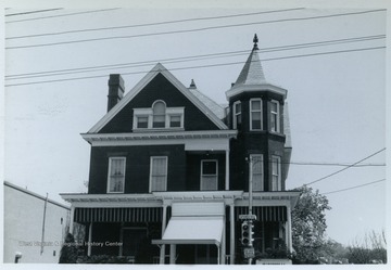 Cox House, Spruce Street, Morgantown, W. Va.  Built in 1898, the home was used as Mancinelli Funeral Home in 1965.From the thesis of "The Influences of Nineteenth Century Architectural Styles on Morgantown Homes," call number NA7125.P481965.