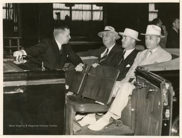 "President Roosevelt as he inspected the armor plant, Sept. 3rd. Left to right:- J. W. Kinnear, Ass't Mgr., of operations of the plant, Carnegie Illinois Steel Corp.; Pres. Roosevelt, Gov. Homer A. Holt, of West Virginia and Senator Matthew Neely, of West Virginia."