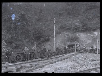 A mining crew poses for a photograph outside of the mine.