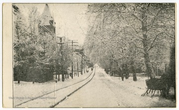 A view of High Street showing the tower of the First Baptist Church, located in the same lot as the present church.