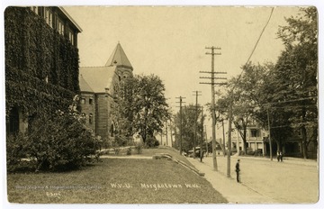 A view down University Avenue of the WVU campus, showing Commencement Hall, Stewart Hall, and Purinton House.