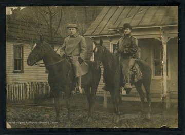 Man on right possibly Art Zinn.  Both appear to be wearing raincoats.