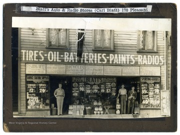 Three men stand in front of Blatt's Auto and Radio Stores, owned by Carl Blatt, 170 Pleasant Street.