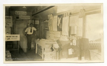 "A corner of the potato grading and marketing exhibit which sought to encourage better grading, higher quality and improved sacking of potatoes. Also the needs of Charleston and vicinity as a market."