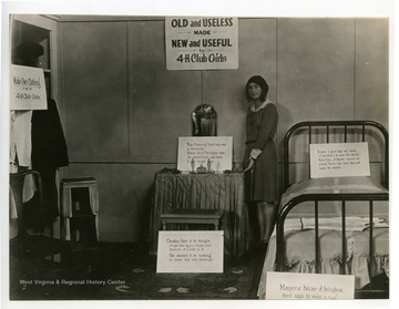 "Old and Useless made New and Useful," Display features clothing and household items that have been repaired or made from other items.