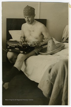 Carl B. Allen at work during the inaugural trans-Pacific passenger flight of Pan American World Airways from San Francisco to Manila. At the time Allen worked as a journalist for the New York Herald Tribune.