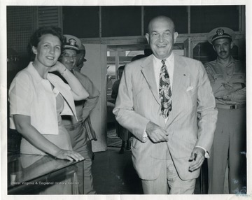 Secretary of Defense Louis Johnson conducts an inspection and shopping trip at the Navy Ship's Store in Guam, also known as The Jade Shop.