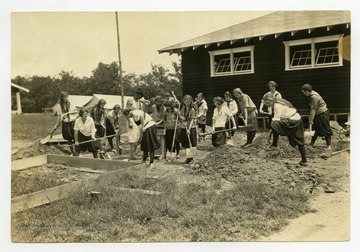 Girls working on a project, likely at the State 4-H Camp at Jackson's Mill.