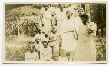 African American Women and children leaving the demonstration, books in hand.