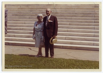 Louis and Ruth Johnson at the Fiftieth Anniversary of the Class of 1912, pictured at the foot of the Rotunda steps at the University of Virginia, Charlottesville. 