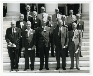 The law school class of 1912 at the University of Virginia poses for a photograph on the steps of the Rotunda on the University's campus. Pictured in the upper left hand corner is Louis Johnson, later Secretary of Defense. Also pictured first row left to right: John Alan Maphis, Clarence Wagener, Col. H. Marbury Taylor, William N. Neff, and Dr. Samuel S. Irvin.  Second Row: Seth Burnley, Judge C. K. Richards, Richard H. Akers, John B. Hyde, Dudley Bagley.  Third Row: Col. Louis A. Johnson, Peyton Randolph Harris, E. Bradford Tazewell, Dr. Cary Jacob.