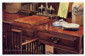 "The "Good Earth" desk- an antique Chinese hardwood piece at which Nobel Prize and Pulitzer Prize winning author Pearl S. Buck penned her famous novel- is on display with other Asian and American antiques."