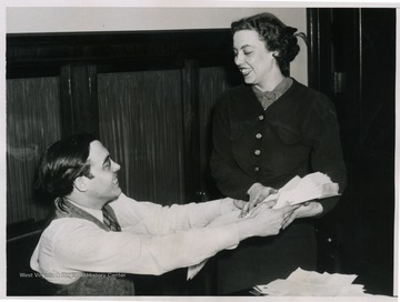 Senator Holt and his sister, Mrs. Ralph R. Chase, sort through mail regarding President Roosevelt's proposed judicial reform.