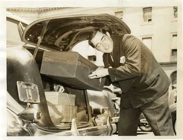 "Senators at the Capitol pack away their books and get out their vacation equipment while waiting for the last day of this session which they hope will be tonight or tomorrow."International News Photos, Washington D.C.