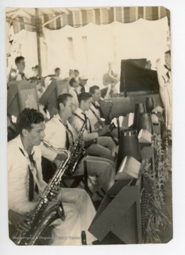 Back of photo reads: "Sax sec[tion]. Hill (1), Ed (2), Sal. (3), Jim (4)