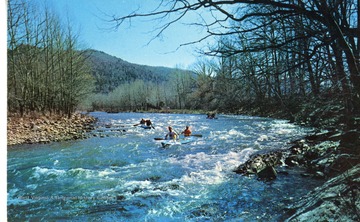 Text on the back reads, "Scenes at White Water Weekend, Petersburg, W. Va. The South Branch of the Potomac offers exciting white water for canoeist and kayakist. Taking one of the rapids in 14 mile course of the race."