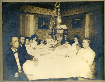 L to R: Isaac M. Kelly Sr., Isaac Kelley Jr., Hilda, Arthur Lil, Mary Elizabeth, Jen, John, Cora, Edith, Frank, Grandmother Kelley.Description on back of photo reads: "Isaac Jr. & Hilda were married August 13, 1909 in Clarksburg, W. Va. at Jen's house (Mrs. Nathan Staley) on Lee Street.