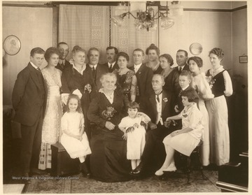 Front row: Mary Elizabeth Staley (daughter of Nate & Jen), Grandmother Kelley, Gwen Kelley (daughter of I.M.K. Jr.), Grandpa Kelley, Frank & Cora (Edith & John's children).Back row: Bowen & Mary Kelley (brother and sister, Frank's children), Frank White (MAry Kelley's husband), Maggie & Frank, Anthony & Cora, John, Jen, Lillian (Phoebe), Isaac Jr. & Hilda, Edith Bowen.