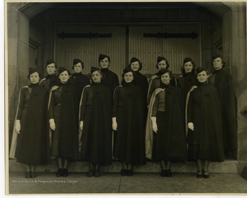 First row (left to right): Regina Pickus, Co. C, Beckley; Lucy Jones, Band Sponsor, Morgantown; Mildred Collier, Regimental Sponsor, Kermit; Mary Lousie McEnteer, Co. B, Clarksburg; Nelma Johnson, Co. A, Nutter Fort; Helen Fair, Co. H, Moundsville.Second row: Jane Evans, 1st Battalion, Martinsburg; Jane Grainger, Co. F, Crystal; Catherine Shaffer, Co. E, Madison; Louise Neely, 2nd Battalion, Jane Lew; Merle Ferrell, 3rd Battalion, Lewisburg; Jean Cole, Co. G, Pittsburg PA.; Mary F. Gibbs,, Co. I, Cleveland, Ohio (substitute for Caroline McEnteer, Clarksburg). 