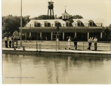 Building viewed from behind, across the camp swimming pool. 