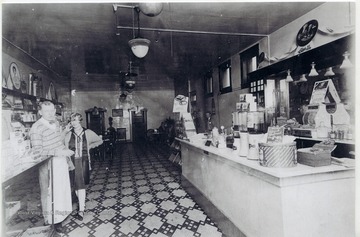 Rene Henry (L) and an unidentified woman in Frank Henry's store in South Charleston.