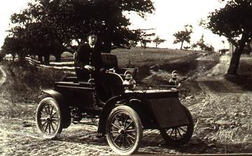 Taken in 1900. Forney Wade driving one of the 1st automobiles in Morgantown.