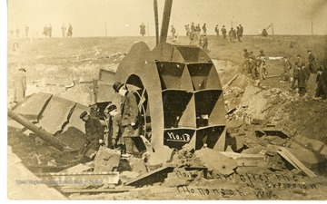 Front: "Fan after the Explosion Monongah, W.Va" Back: "See if you can find grandpa on this card. To Fred from Aunt Lessie."