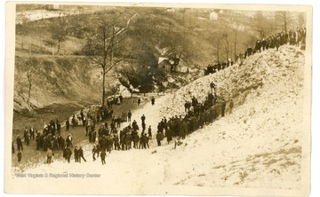 People gathering to look at where the only living man was found from the 1907 Monongah Mine Disaster.