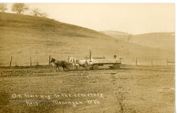 Caskets from the Monongah Mine Disaster being carried off to the cemetery. Back of postcard reads: "Mine explosion at Monongah, W.Va. A Merry Christ and Happy New Year."