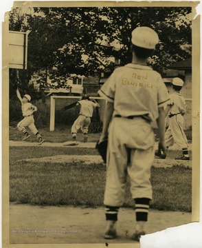 Player in foreground is identified as Ben Bonifili. 