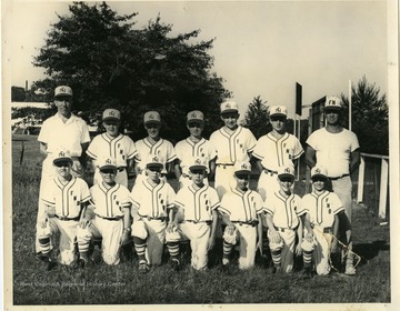 Bob Prim is standing first on the left.