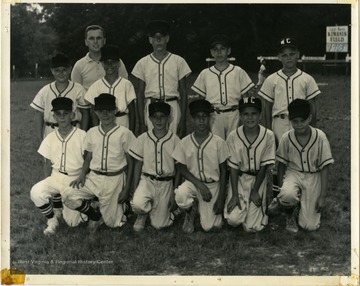 The team is standing at Kiwanis Field.