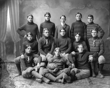 The football held by the player in front reads "'Preps' '01".