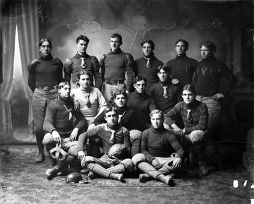 The football held by a player in the front row reads "WVU All-Stars '01".