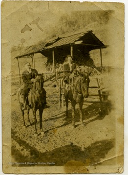 A picture of Betty Caldwell Blisins and her husband on horses.