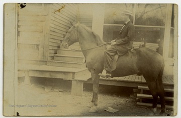 Willis Hatfield astride a horse.