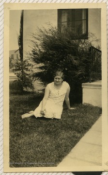 Ruby Gibson sitting on the ground. 